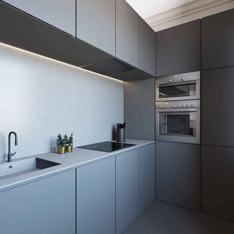 Kesan monokrom sangat kental pada dapur yang satu ini. Untuk anda penggemar dapur monokrom modern dapat memilih kitchen set minimalis tanpa adanya corak yang menonjol dengan warna abu-abu simetrikal. Sedikit pemanis terlihat dari adanya aksen warna putih pada countertop