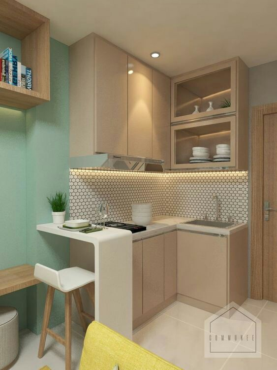 Kesan sederhana terpancar dari dapur mungil satu ini. Dengan warna soft beige pada kitchen set minimalisnya, nuansa hangat langsung terpancar. Untuk membuat penampilan dapur lebih cantik lagi, rak atau lemari daput terbuka bisa dijadikan alternatif untuk menempatkan peralatan makan atau hiasan dapur