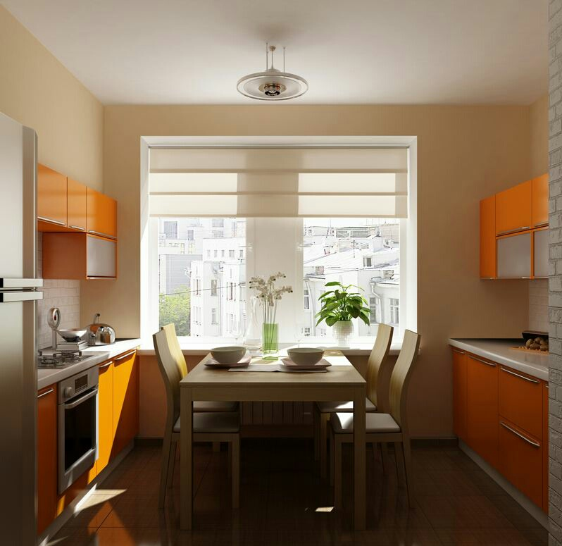 Agar mendapatkan kesan hangat di dalam ruangan dapur, pilihlah warna dasar dengan warm tone seperti cokelat atau beige pada bagian dinding. Lalu anda bisa padukan dengan kitchen set berdesain simpel namun mempunyai warna yang mencolok seperti orange