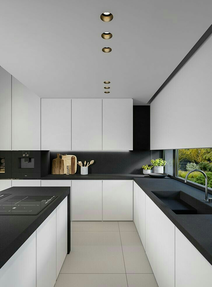 Dapur sleek dengan kombinasi hitam putih ini sangat pas untuk orang-orang yang tidak suka dengan warna cerah di area dapur. Finishing matte pada countertop dan kitchen set membuat dapur minimalis ini terlihat lebih elegan dan modern