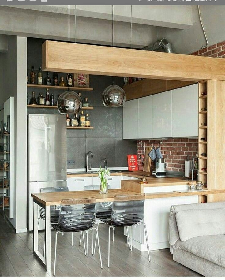 Untuk dapur kecil 2x2 anda, anda bisa mendesainnya dengan tema industrialis. Tema ini bisa didapatkan dengan menambahkan aksen batu bata berwarna merah untuk area dinding dan lampu gantung dengan warna krom