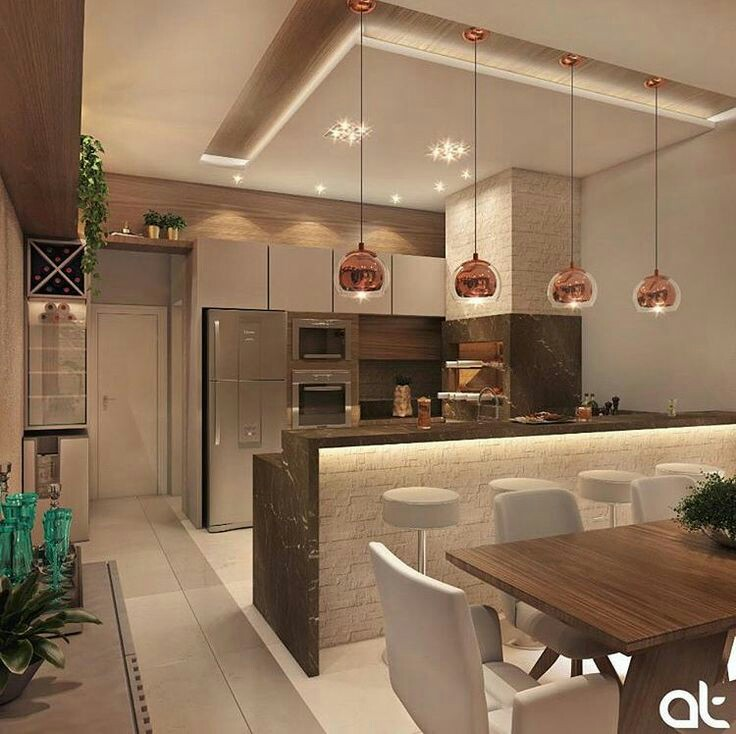 Mewah tidak harus selalu terlihat dari desain kitchen set yang besat dan rumit, dengan desain dapur minimalis, anda dapat menambahkan aksen rose gold pada lampu gantung untuk kesan lebih menarik