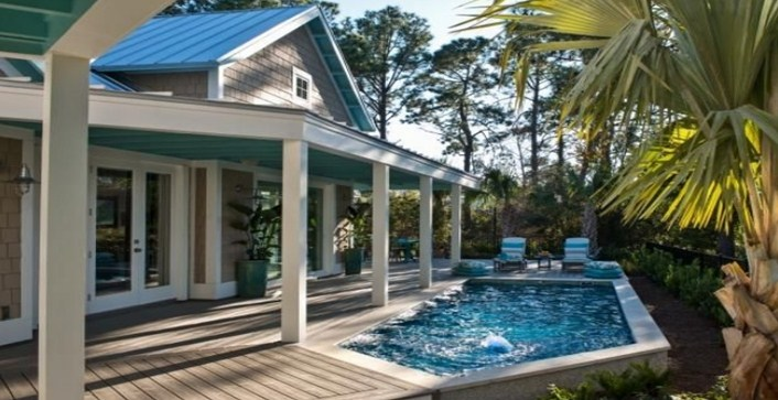 Desain rumah dengan kolam renang Dilengkapi dengan tempat bersantai