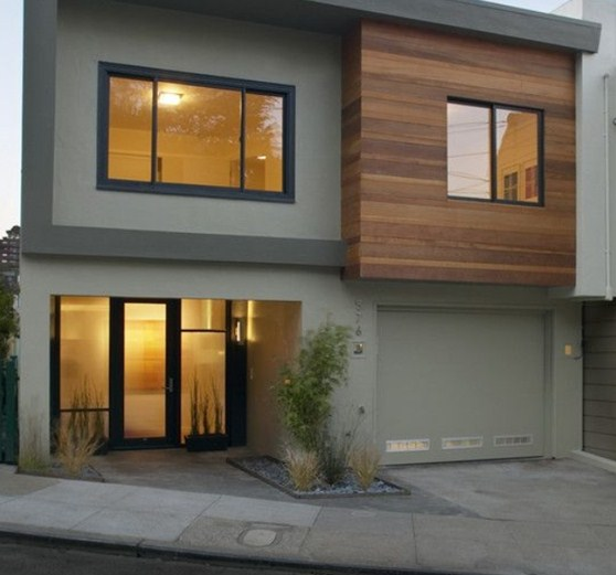 Nuansa minimalis yang menawan terlihat dari variasi warna abu yang menghiasi tampilan rumah kost ini